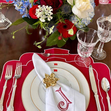 Load image into Gallery viewer, Decorative table setting with flowers, cutlery, and a red placemat.
