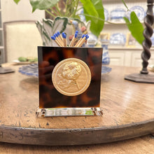 Load image into Gallery viewer, Matchbox holder with coin design on a wooden table