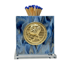 Load image into Gallery viewer, Matches with blue matches in a decorative holder featuring a gold coin and portrait on a white background