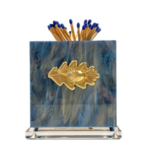 Load image into Gallery viewer, Matches with a decorative holder featuring a gold leaf design on a blue and white background