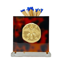 Load image into Gallery viewer, Matches with blue tips in a tortoiseshell case featuring a gold emblem on a white background