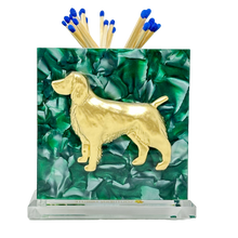 Load image into Gallery viewer, Matchbox holder with gold dog design and matches on a green leafy background