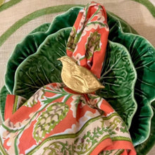 Load image into Gallery viewer, Decorative napkin with a gold bird accent on a green plate