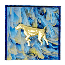 Load image into Gallery viewer, Gold dog-shaped object on a blue and white marbled background