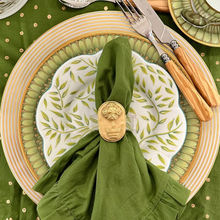 Load image into Gallery viewer, Dining table setting with green placemat, plates, and cutlery on a white surface.