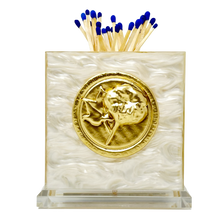 Load image into Gallery viewer, Decorative matchstick holder with gold emblem and blue matches on a white background