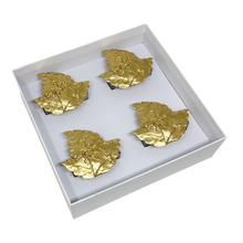 Load image into Gallery viewer, Four gold tobacco leaf napkin rings in a white box on a white background