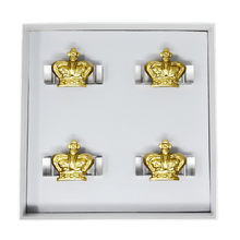 Load image into Gallery viewer, Set of gold crown-shaped napkin rings in a display case on a white background