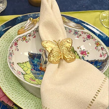 Load image into Gallery viewer, Napkin with a gold butterfly on a colorful plate setting
