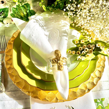 Load image into Gallery viewer, Easter table setting with gold and green plates, napkins, and bunny decorations.
