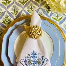 Load image into Gallery viewer, Decorative table setting with plates, napkin, and cutlery on a patterned tablecloth.
