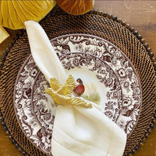 Load image into Gallery viewer, Decorative plate with floral and bird pattern on a woven placemat
