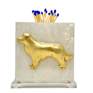 Matchbox holder with gold dog design on a white background