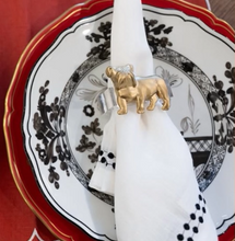 Load image into Gallery viewer, Two decorative plates with napkins on a brown background
