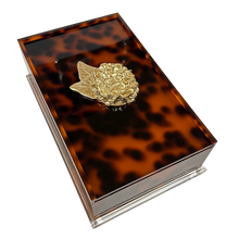 Load image into Gallery viewer, Tortoiseshell-patterned box with a gold emblem on a white background
