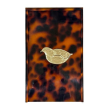 Load image into Gallery viewer, Tortoiseshell case with a gold bird emblem on a white background
