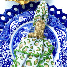 Load image into Gallery viewer, Decorative plate with a gold napkin holder and pears in the background
