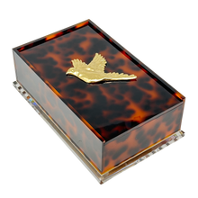 Load image into Gallery viewer, Tortoiseshell-patterned jewelry box with a gold bird emblem on a white background
