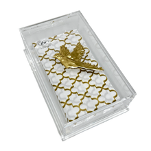 Load image into Gallery viewer, Phone case with gold geometric pattern and bird design in clear packaging on a white background
