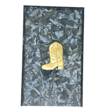 Load image into Gallery viewer, Gold cowboy boot on a textured black and gray background
