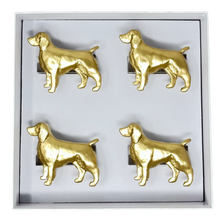 Load image into Gallery viewer, Set of four gold dog-shaped napkin rings in a box on a white background
