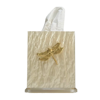 Tissue holder with gold dragonfly design on a textured beige surface