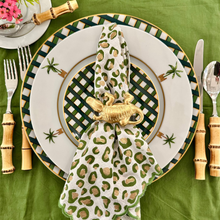 Load image into Gallery viewer, Decorative table setting with leopard print napkin, green checkered plate, and bamboo utensils on a green tablecloth.
