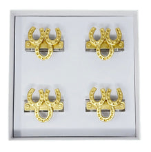 Load image into Gallery viewer, Set of gold horseshoe-shaped napkin rings in a box
