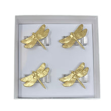 Load image into Gallery viewer, Set of gold dragonfly napkin rings in a box on a white background
