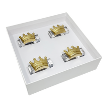 Load image into Gallery viewer, Set of four gold and silver crown-shaped napkin rings in a white box on a white background
