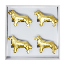Load image into Gallery viewer, Set of four gold dog-shaped napkin rings in a box on a white background
