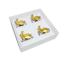 Load image into Gallery viewer, Set of four gold rabbit napkin rings in a white box on a white background
