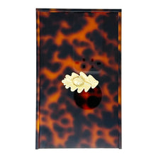 Load image into Gallery viewer, Tortoiseshell patterned switch plate with a gold decorative plate on a white background

