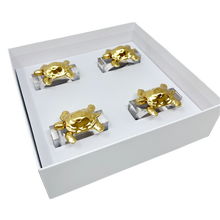 Load image into Gallery viewer, Four gold and silver decorative items in a white box on a white background

